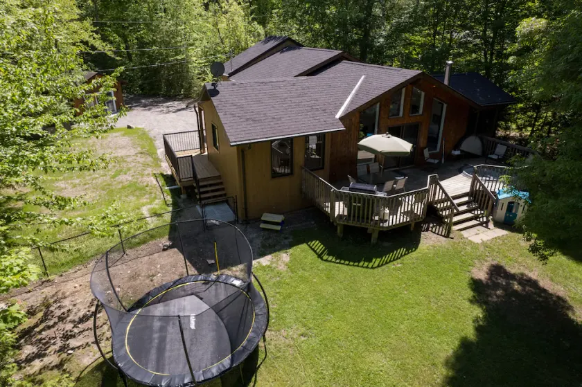 Serenity Now! Beautiful Drag Lake. Beach, dock, hot tub and fire pit. Flat lot. - Image 1