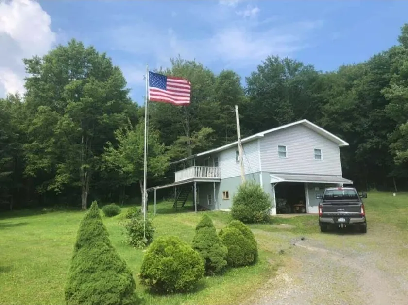 Cozy camp located in Elk County adjoining state game land. - Image 1