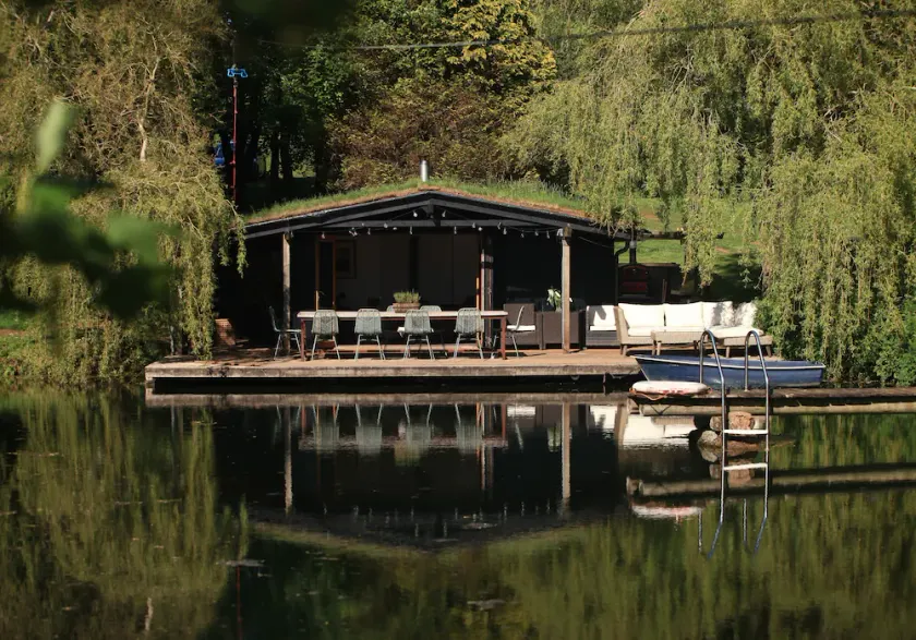 Sitting on the edge of a lake by itself. - Image 1