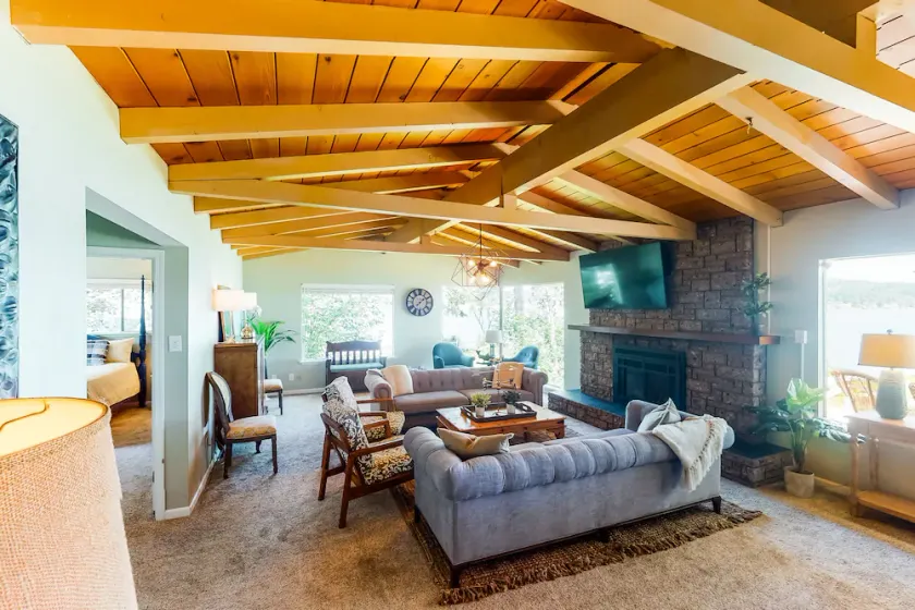Inviting bayside dwelling with beach access, deck, waterfront views, & fireplace - Image 1
