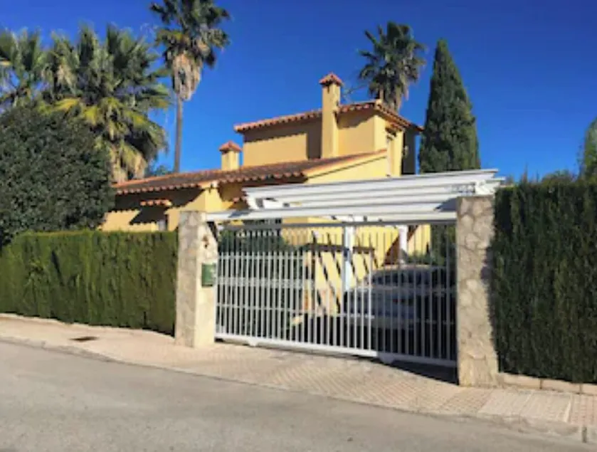 Oliva Nova Golf Yellow House - Image 1