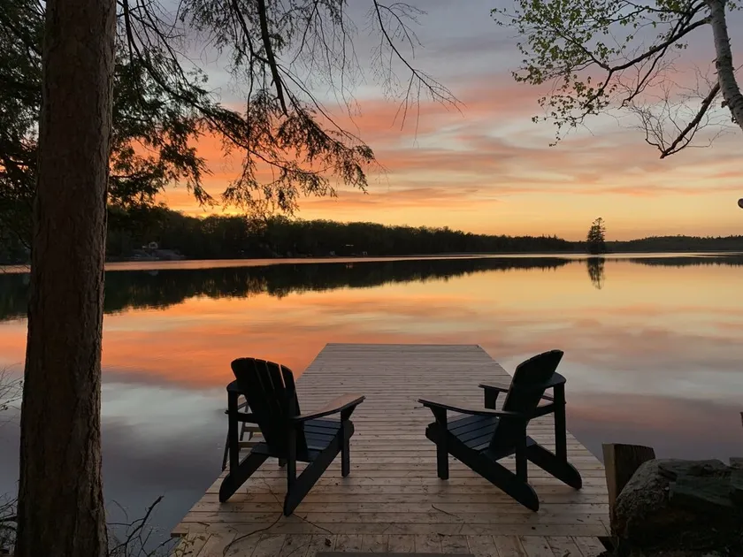 Waterfront Cottage w/Sunset Views, Dock, & Family Fun | Kayaks, Firepit, Fishing - Image 1