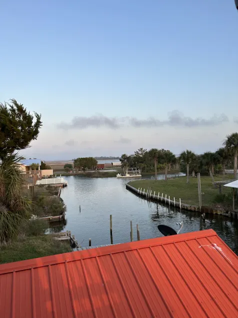 Coastal meets country in this small but spacious canal home. - Image 1