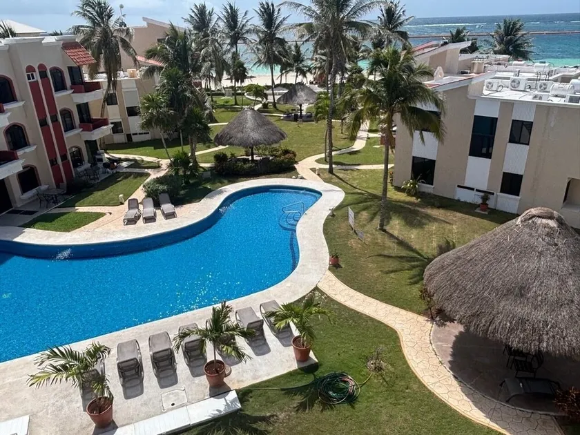 PlayaSol Beachfront Condo with large pool, steps to beach,  walk to town square - Image 1