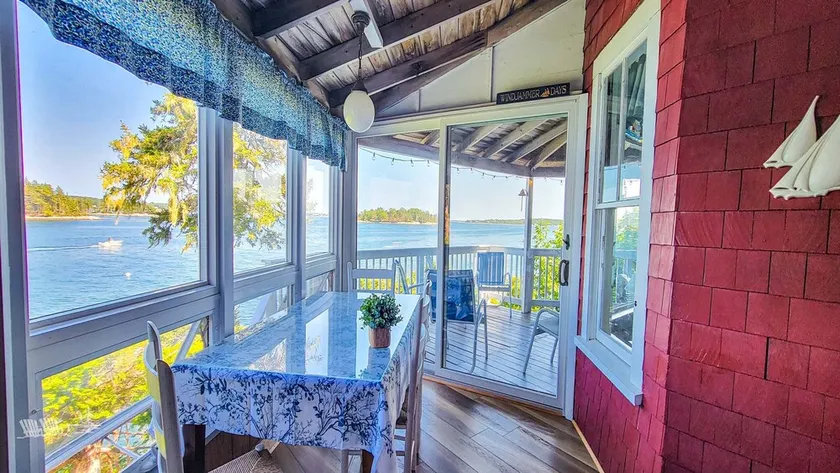 Experience lakeside luxury at Piffi Biff, a spacious 5-bedroom cabin on Southport, ME. - Image 1