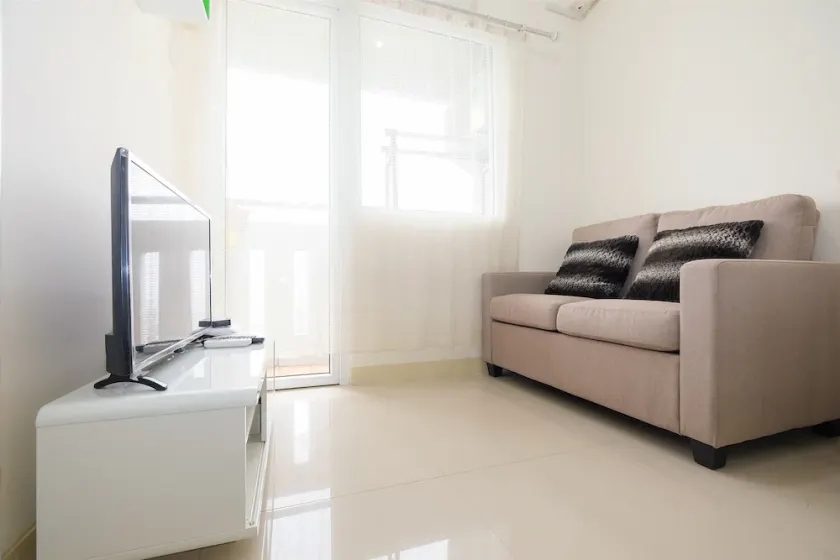 2 Bedrooms at Green Pramuka City Apartment By Travelio - Image 1
