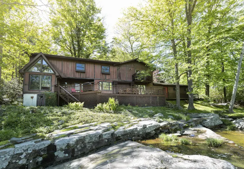 Private 10-Acre Creekside Cabin—80-Ft Deck, Fire Pit, Wildlife & Cozy Spaces! - Image 1