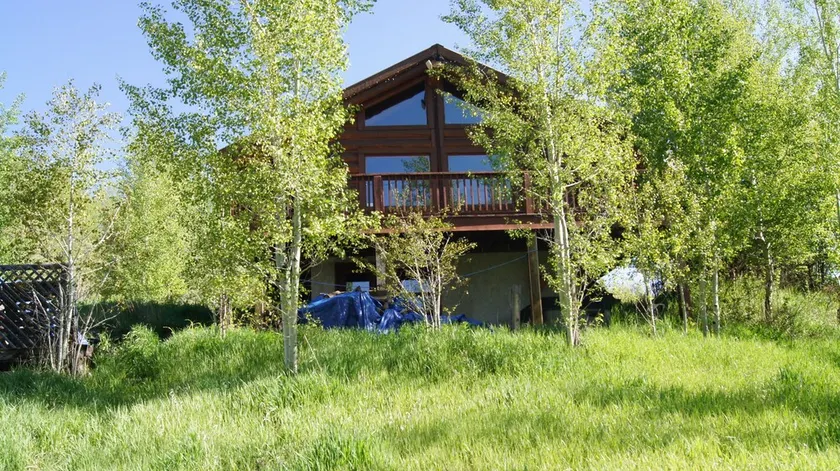 Log cabin on 5 acres in Wilson Wyoming - Image 1