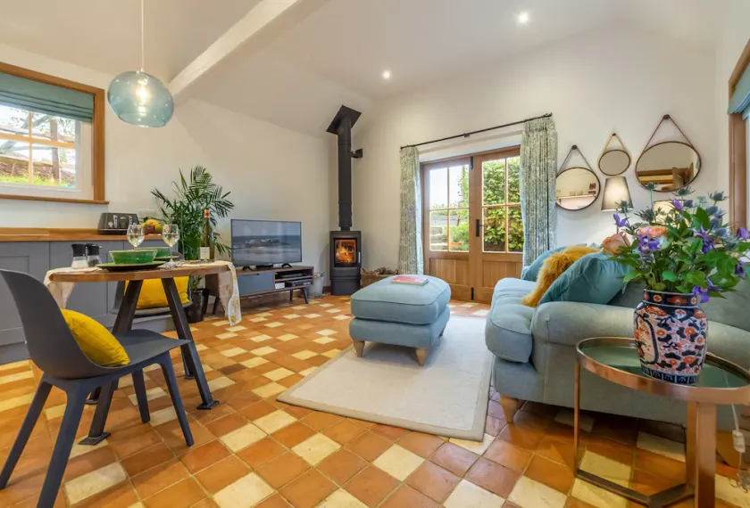 A light and airy property with a hammock and hot tub, situated on a working farm - Image 1