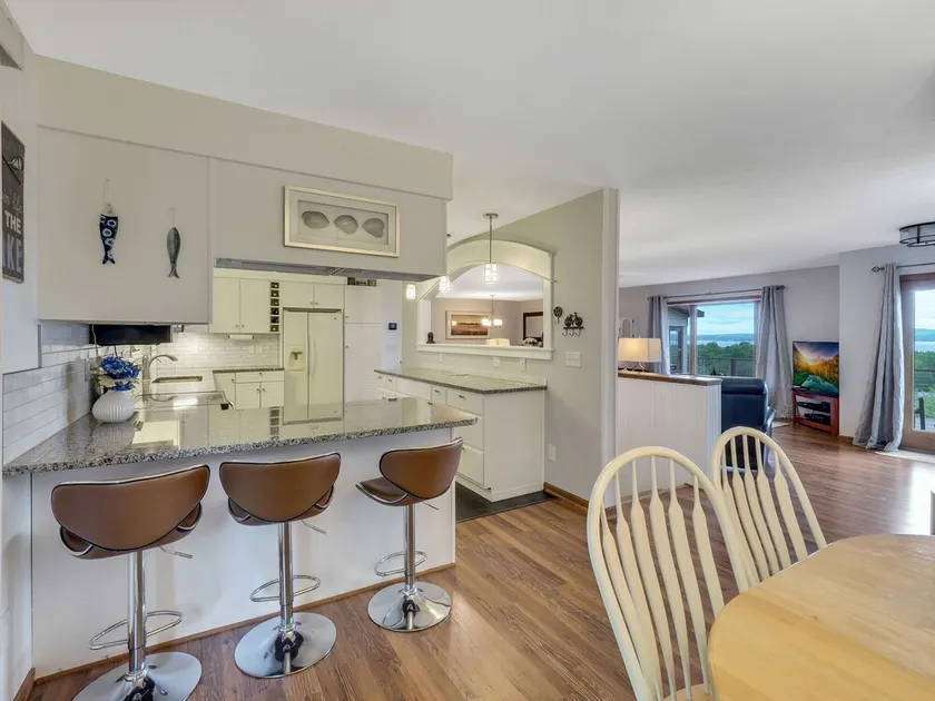 Beautiful views of Little Traverse Bay and a spacious wraparound deck - Image 1