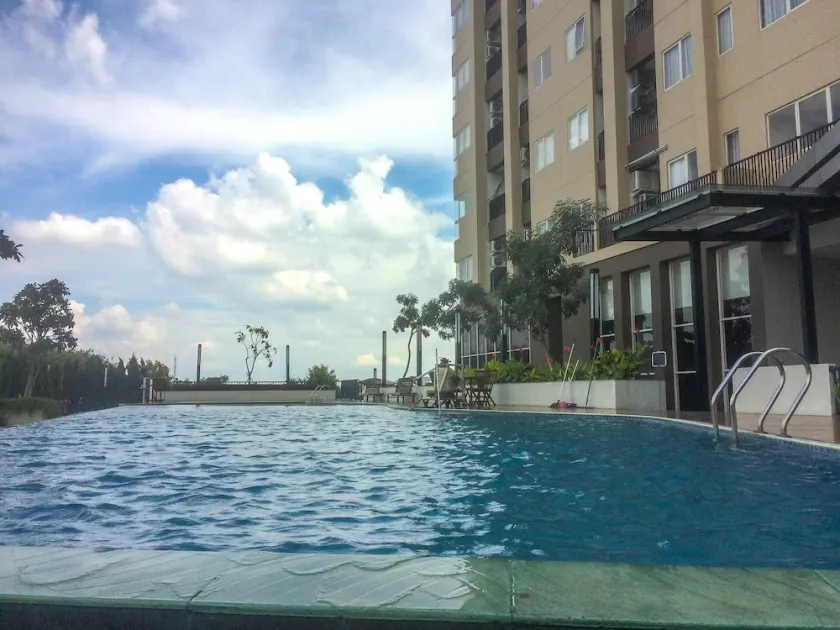 Minimalist and Posh 1BR The Oasis Cikarang Apartment By Travelio - Image 1