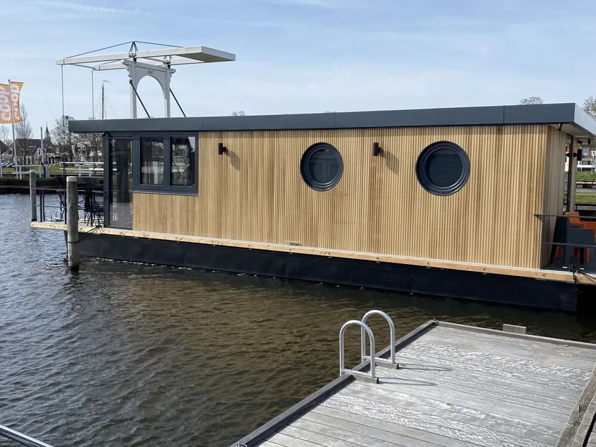 Luxury Houseboat with swim platform in colorful harbor - Image 1