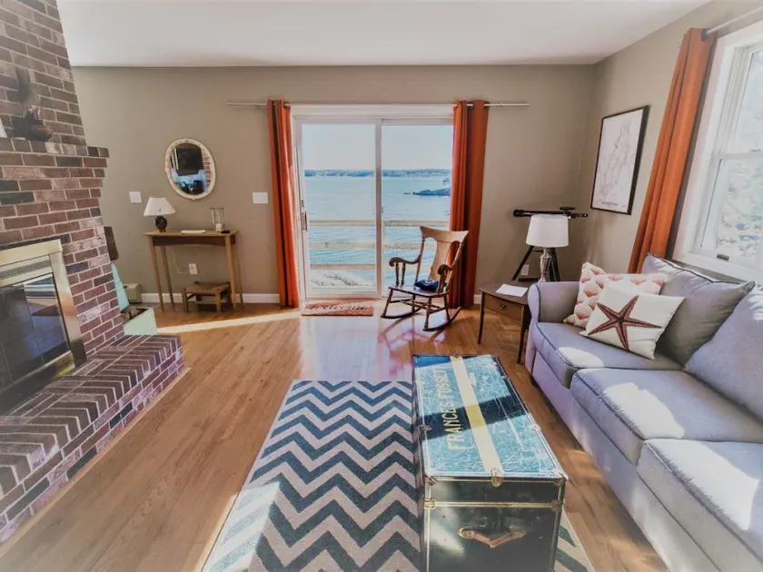 Enjoy the stunning views while relaxing on the deck at East Ledge Cottage - Image 1