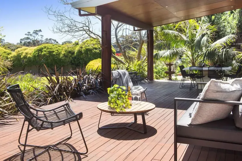 A stylish and modern home, situated in manicured gardens. - Image 1