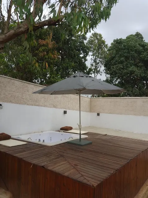 House with a large green area. Featuring a spa and gourmet area. - Image 1