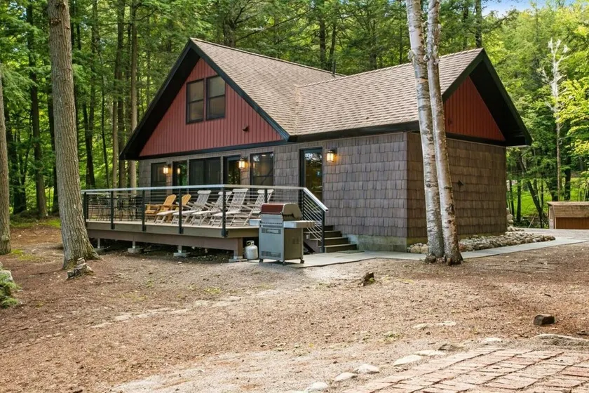 Lakefront home steps away from a private, gentle sloping sandy beach & fire pit. - Image 1