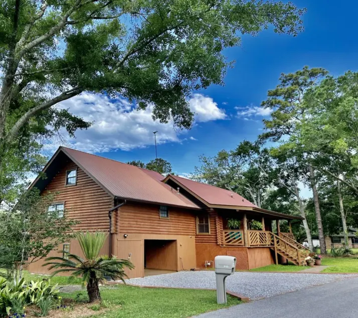 BEAUTIFUL WATERFRONT .  GNAT SCREENED BOATHOUSE AND AJOINING COVERED BOAT SLIPS  - Image 1