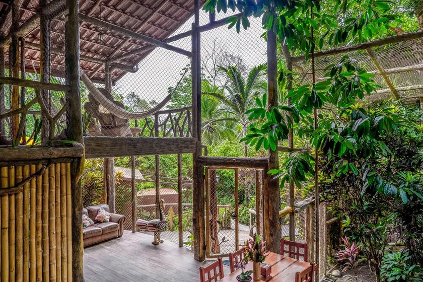 Secluded Treetop Home w/solar panels, Private Balcony, steps from the beach - Image 1