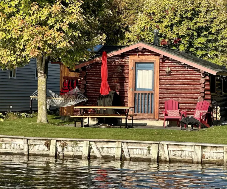 Northern Michigan Getaway - Cozy Log Cabin right on Crooked Lake Waterfront - Image 1
