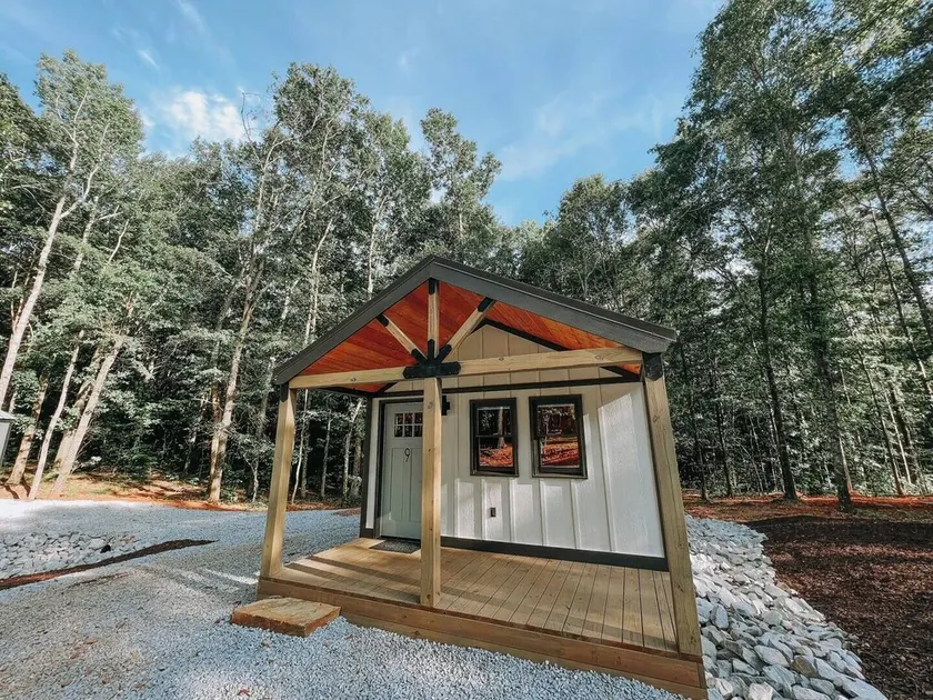 Cabin #9: One king-size bed, a kitchenette, and a large gravel parking pad beside the cabin for easy boat or trailer storage. - Image 1