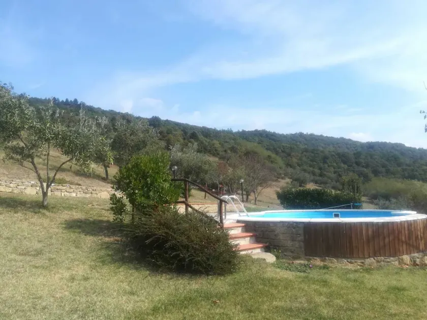 Detached stone view cottage with swimming pool and fenced garden. - Image 1
