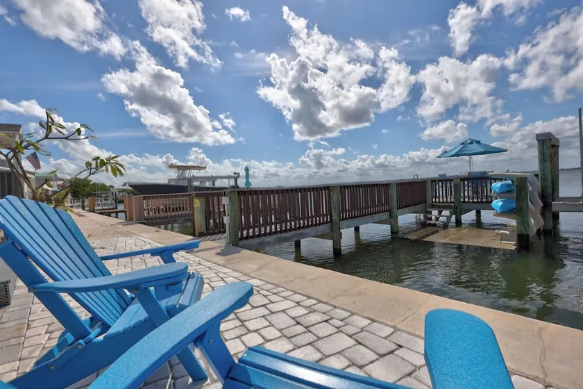 Nettles Island Waterfront with Dock & steps from Beach-plus Golf Cart Credit - Image 1