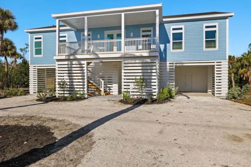 New!!  The Blue Pelican!  Stunningl canal front beauty with direct gulf access! - Image 1