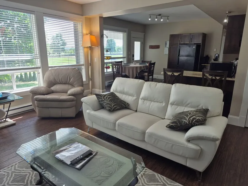 Scenic 2 bdrm walkout suite with shared hot-tub, outdoor pool, and view of park. - Image 1
