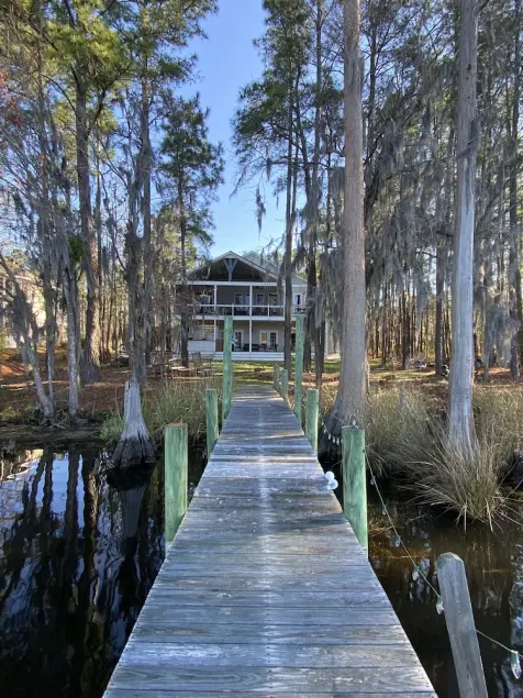 Waterfront home with dock and community boat ramp and HUGE screened in porch. - Image 1