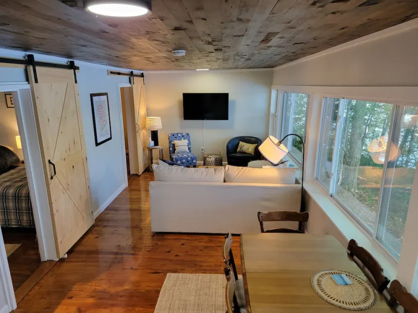 Enjoy Lake life in this renovated Camp, 50 ft from water. Private dock, beach. - Image 1