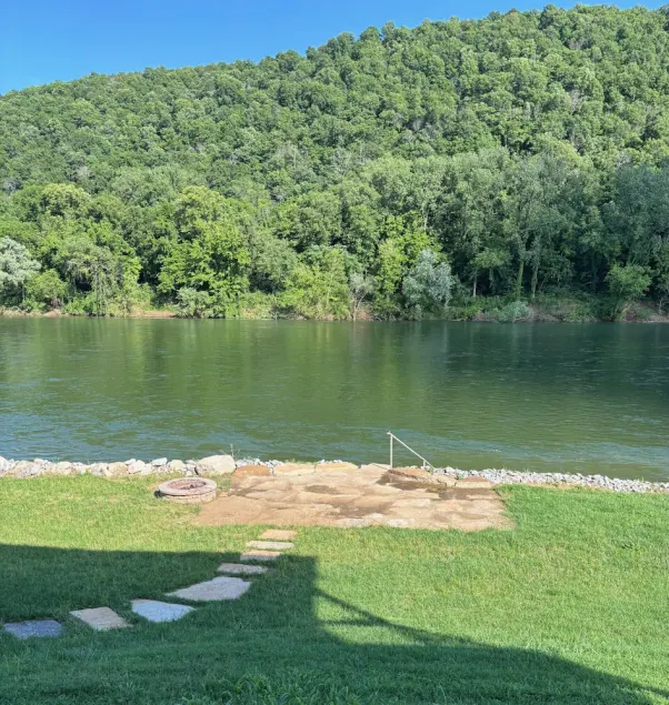 Private riverfront getaway with direct steps to fishing paradise. - Image 1