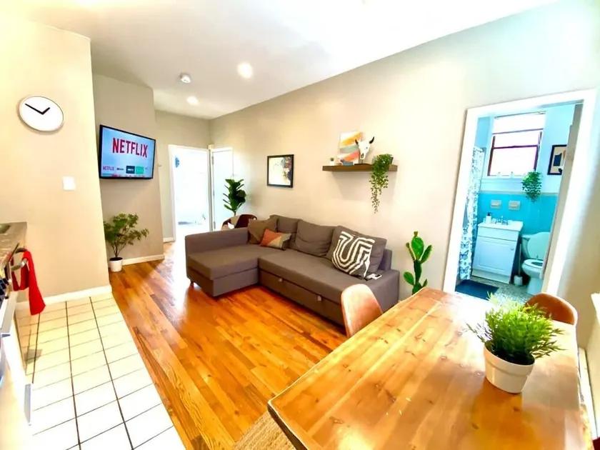Modern & Sunny FamFriendly 2BR Home, 1 stop to NYC - Image 1
