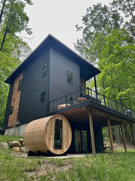 The Holiday House | Modern Wooded Retreat Near TC & Trails | Sauna - Image 1