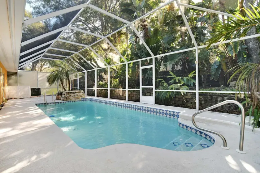 This beauty is centrally located,  with a heated pool and water fall! - Image 1
