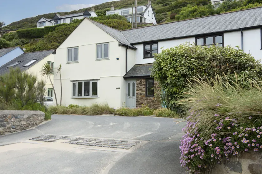 Situated only sixty meters from the Blue Flag sandy beach in the charming coastal village of Porthto - Image 1