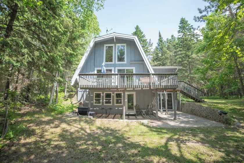 A-frame cabin with sandy swimming beach, 4 bedrooms, and amenities of home. - Image 1