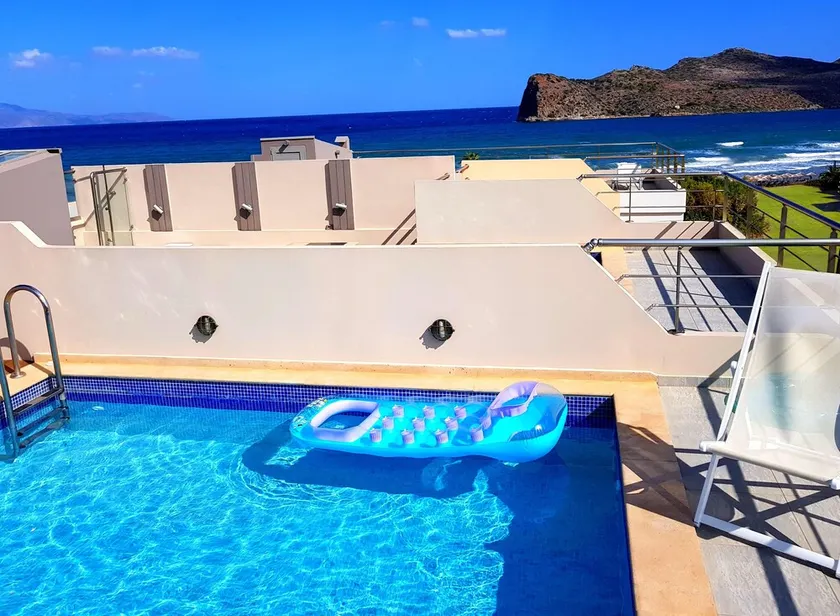 Luxurious 5-bedroom beachfront villa with a private rooftop pool and sea view - Image 1