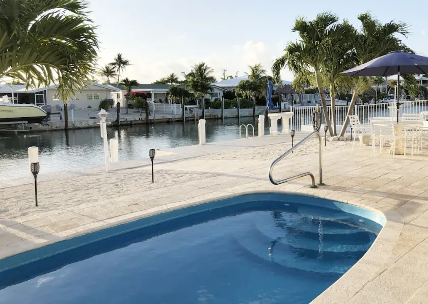 Peaceful canal-front 3/3 Single-Family Home w/ Private Pool & Cabana Club Access - Image 1