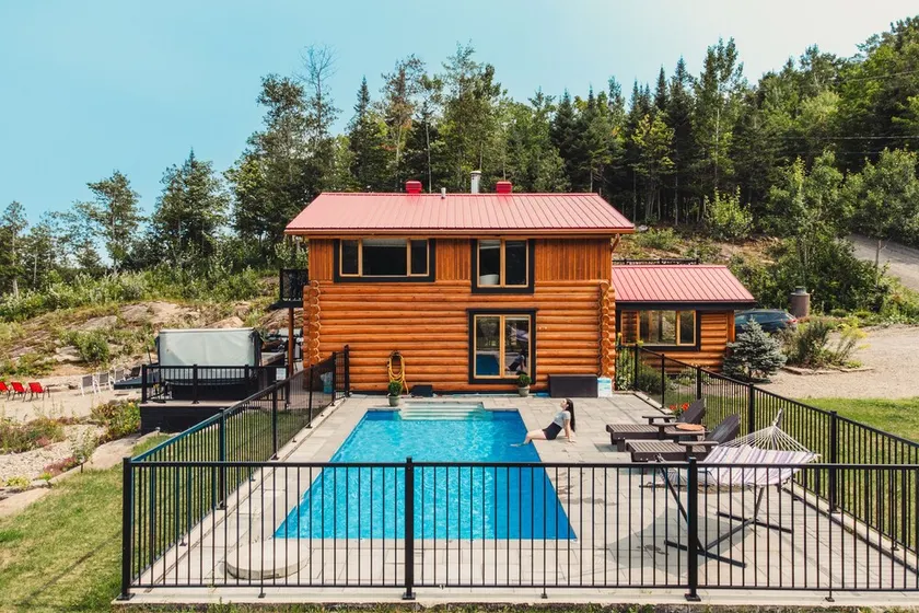 Charming log cabin nestled in the woods, with a spa and in-ground pool.  - Image 1