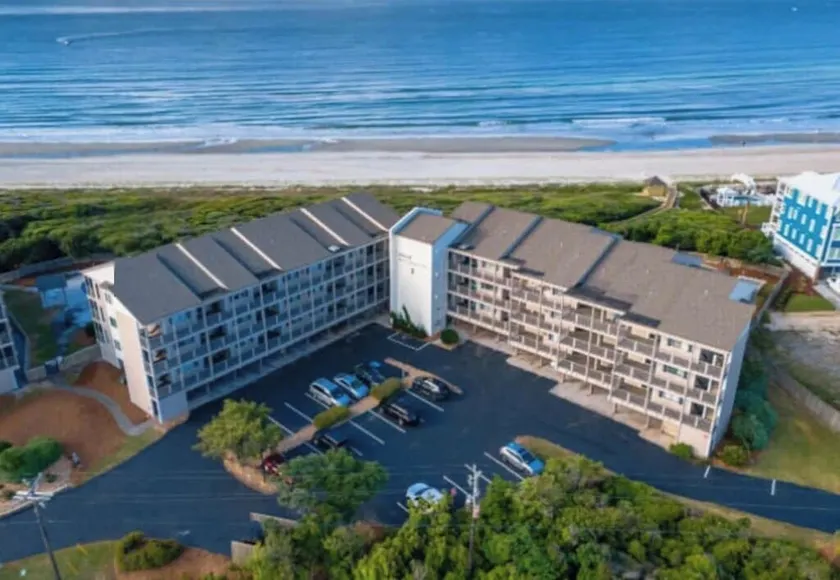 Ocean-side condominium with pool and private beach access - Image 1