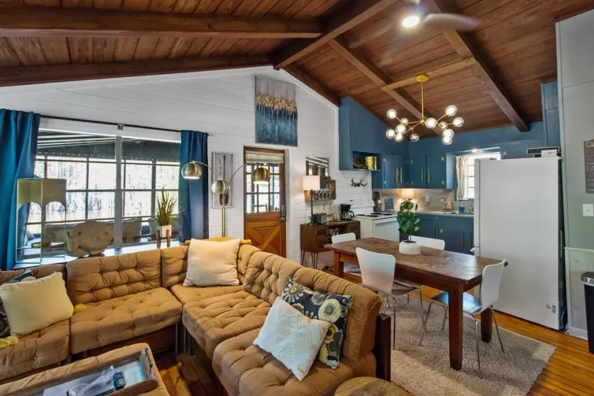 Wake up right at the water’s edge at Emerald Cove—sip coffee from hammock chairs on the screened porch, then paddle beneath a canopy of cypress trees. - Image 1