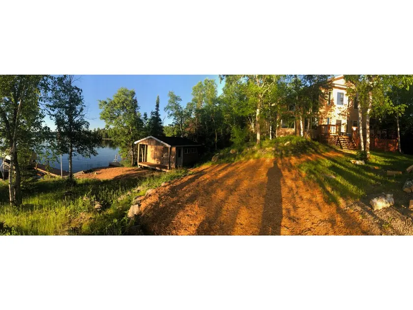 Lake cabin on 5 acres and 780' of shoreline on an island with panoramic views. - Image 1
