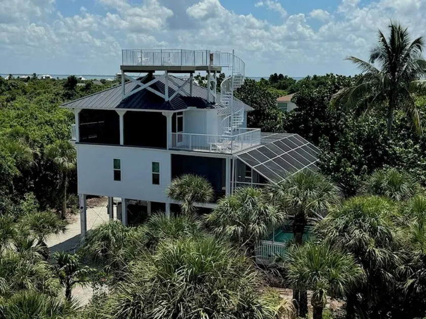 Manatee Haven - Upscale Beach View Home with Screened-in Pool, Spa and Elevator! - Image 1