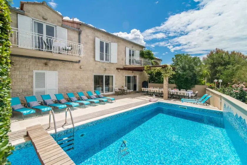 7-BR Beachfront Villa with Seaside Terrace and Heated Swimming Pool - Image 1