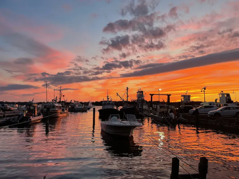 Historic Bristol Harbor Waterfront with Sunsets over Harbor - Image 1