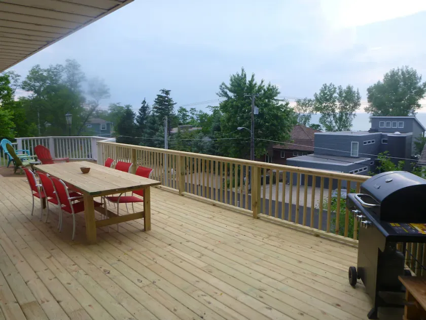 View of the lake from 2 decks in this 6BR Lake Shore Dr home, steps to the beach - Image 1