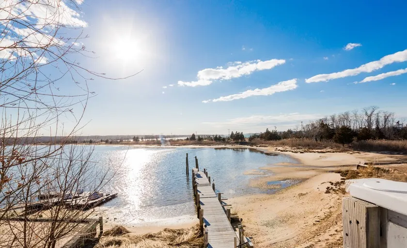 Waterfront on the Bay! A beautiful 5 bedroom home with dock and walk to Beach... - Image 1