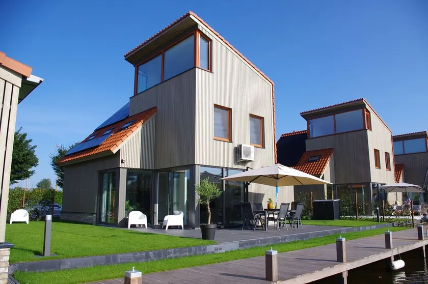 Vacation home on the water with boat, air conditioning, sauna, bike, SUP and BBQ - Image 1