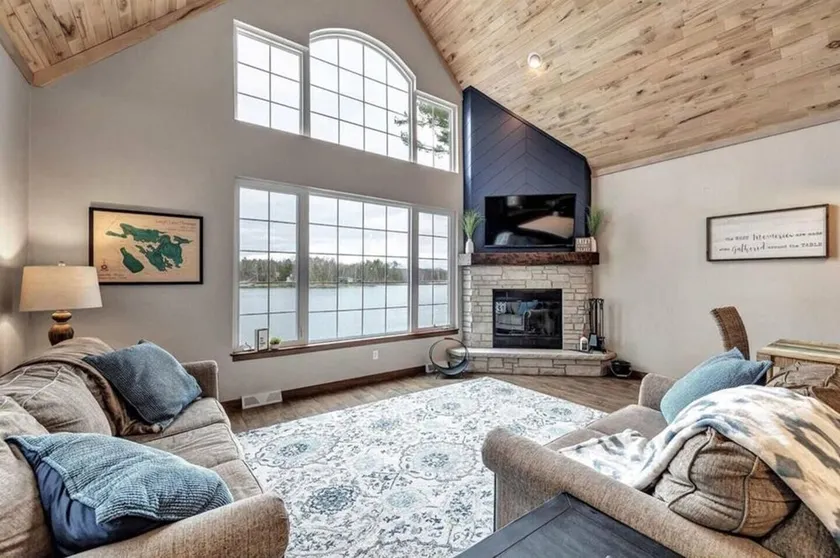 Highlights:<br>Private beach just steps from your door<br>Includes kayaks for exploring the lake<br>Great fishing right off the shoreline or dock<br>Bring your boat and enjoy full boating access<br>Cozy indoor fireplace for cool evenings<br>4 spaciou - Image 1