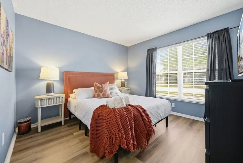 Cozy 2BR Riverview home with adjustable beds, a private fenced backyard, screened lanai, fully stocked kitchen, and garage parking. Conveniently located near Tampa, shopping, dining, and local attractions. - Image 1